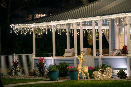 A beautifully landscaped yard adorned with holiday decorations.